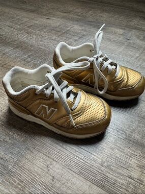 New Balance Kids Metallic Gold and White Sneakers